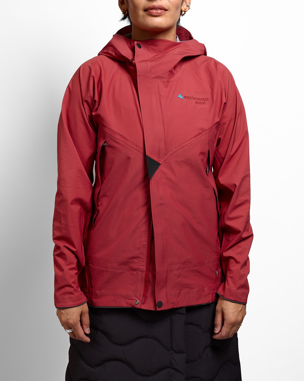 Red jacket with a brand logo on a plain background