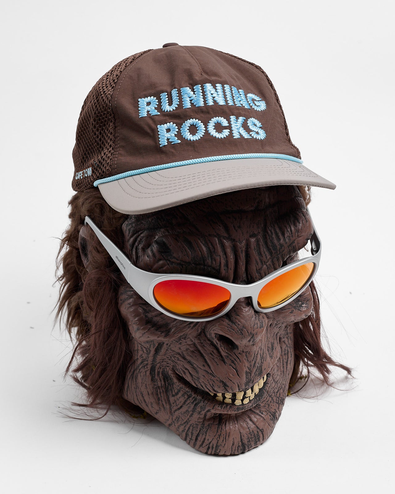 Running Rocks Trucker Hat in Brown